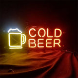 Neon sign with a yellow beer mug icon next to bright red glowing text reading 'COLD BEER' against a dark background.