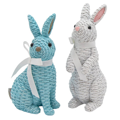 Pair of Colette and Milo Rattan Bunnies: white standing bunny and blue sitting bunny with ribbons