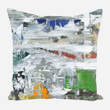 Square pillow with an abstract design of broad, horizontal and vertical brushstrokes in white, blue, red, green, orange, and black on a neutral background.