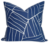 Jordan Woven Pillow Cover in Royal Blue displayed on a sofa with ivory performance fabric backing visible