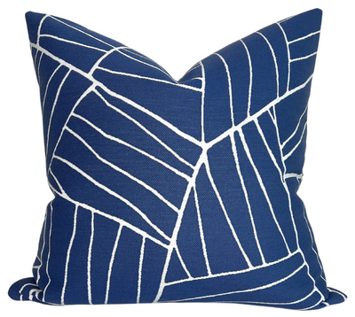 Jordan Woven Pillow Cover in Royal Blue displayed on a sofa with ivory performance fabric backing visible