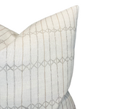 Light sand-colored pillow cover with subtle vertical and diagonal stitch patterns forming diamond shapes, shown on a white background.