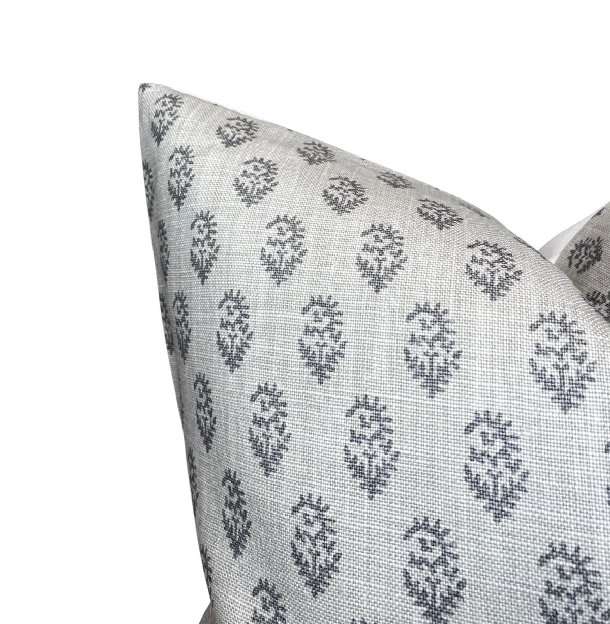 Square pillow cover in ash grey fabric featuring a repeating tonal pattern of small, dark grey motifs arranged in rows against a textured background.