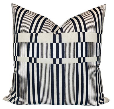 Kelly Wearstler Bandeau Pillow Cover in tawny displayed on a sofa