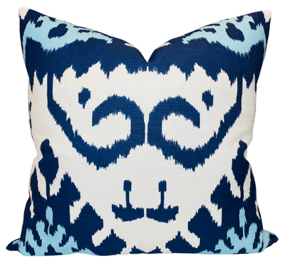 Kazak Ikat Pillow Cover in Navy Blue showing front Kazak printed fabric and ivory linen back in neutral setting