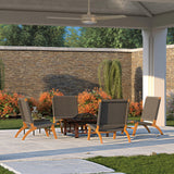 Outdoor patio set with four modern lounge chairs featuring woven grey seats and light wooden legs around a dark wooden hexagonal table under a white pergola with ceiling fan.