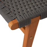 Close-up of a wooden chair leg with grey woven rope seat showing tight, parallel braiding and a small brass bolt on the leg
