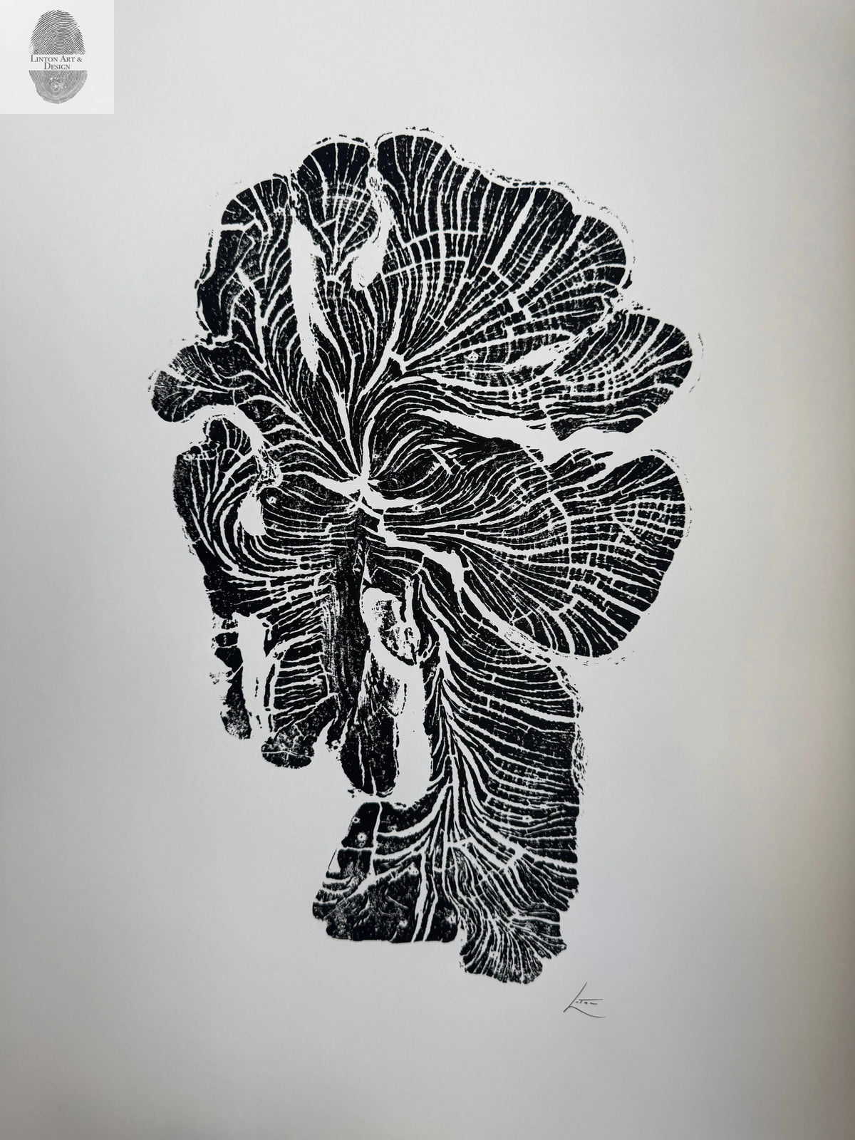 Black ink woodcut print of an irregularly shaped crab apple tree ring with detailed growth rings on white background, signed in lower right corner.