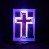 Illuminated cross acrylic box neon sign glowing indoors
