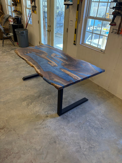 6x3 walnut river table with blue resin inlay in a workshop setting