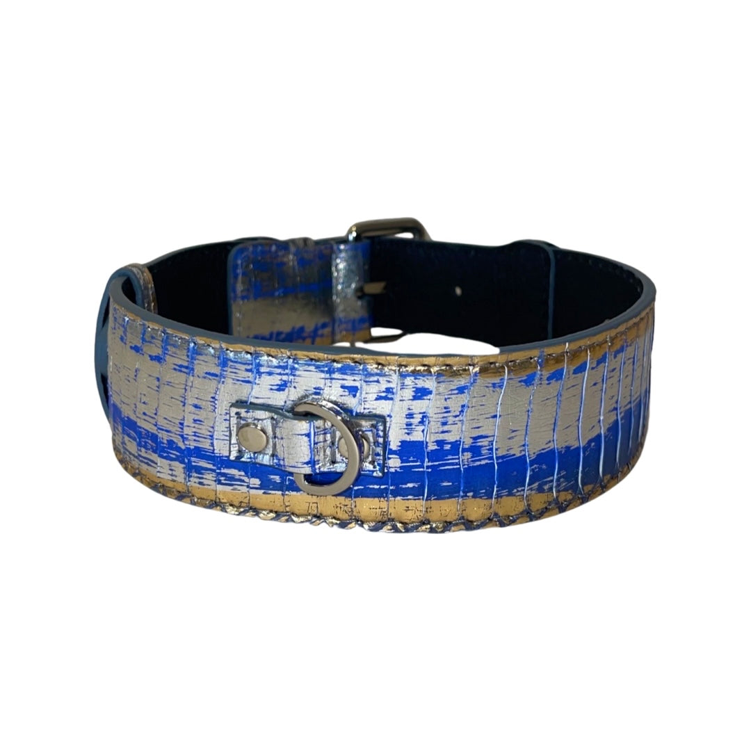 Dog collar with a textured pattern in metallic blue, silver, and gold colors featuring silver hardware and a small D-ring on the front.