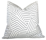 Black and ivory deconstructed stripe pillow cover from DEKOWE shown indoors