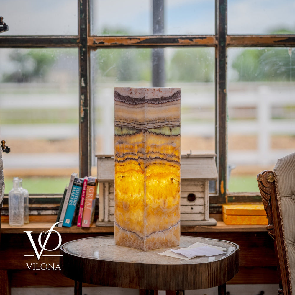 Vilona Onyx Aqua Onyx Square Table Lamp 20 inches tall with golden and beige banded onyx stone base illuminated