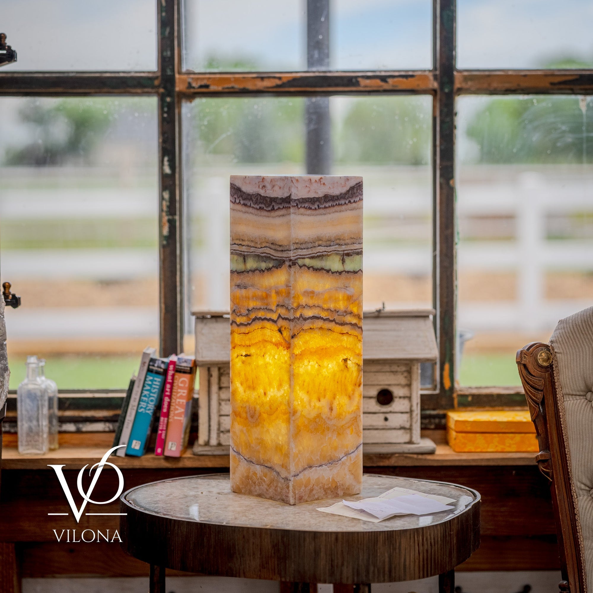 Vilona Onyx Aqua Onyx Square Table Lamp 20 inches tall with golden and beige banded onyx stone base illuminated