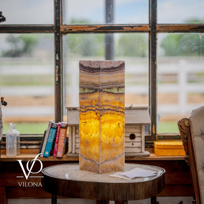 Vilona Onyx Aqua Onyx Square Table Lamp 20 inches tall with golden and beige banded onyx stone base illuminated