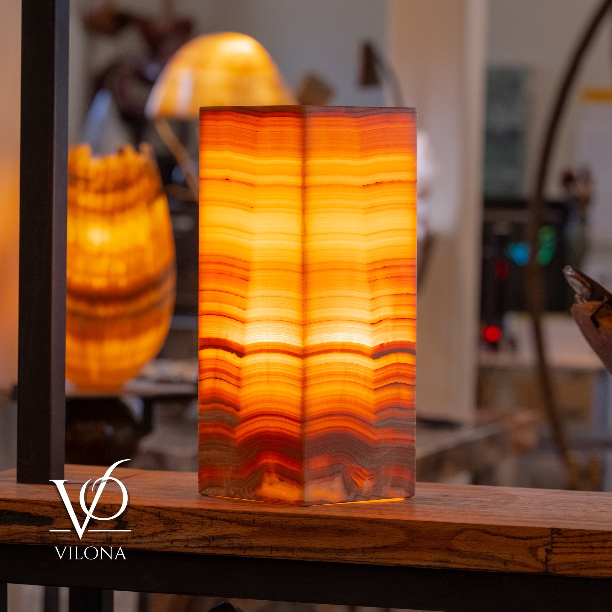 Large square Miami Sunset Onyx table lamp with warm orange and cream mineral veins, glowing softly on a surface.