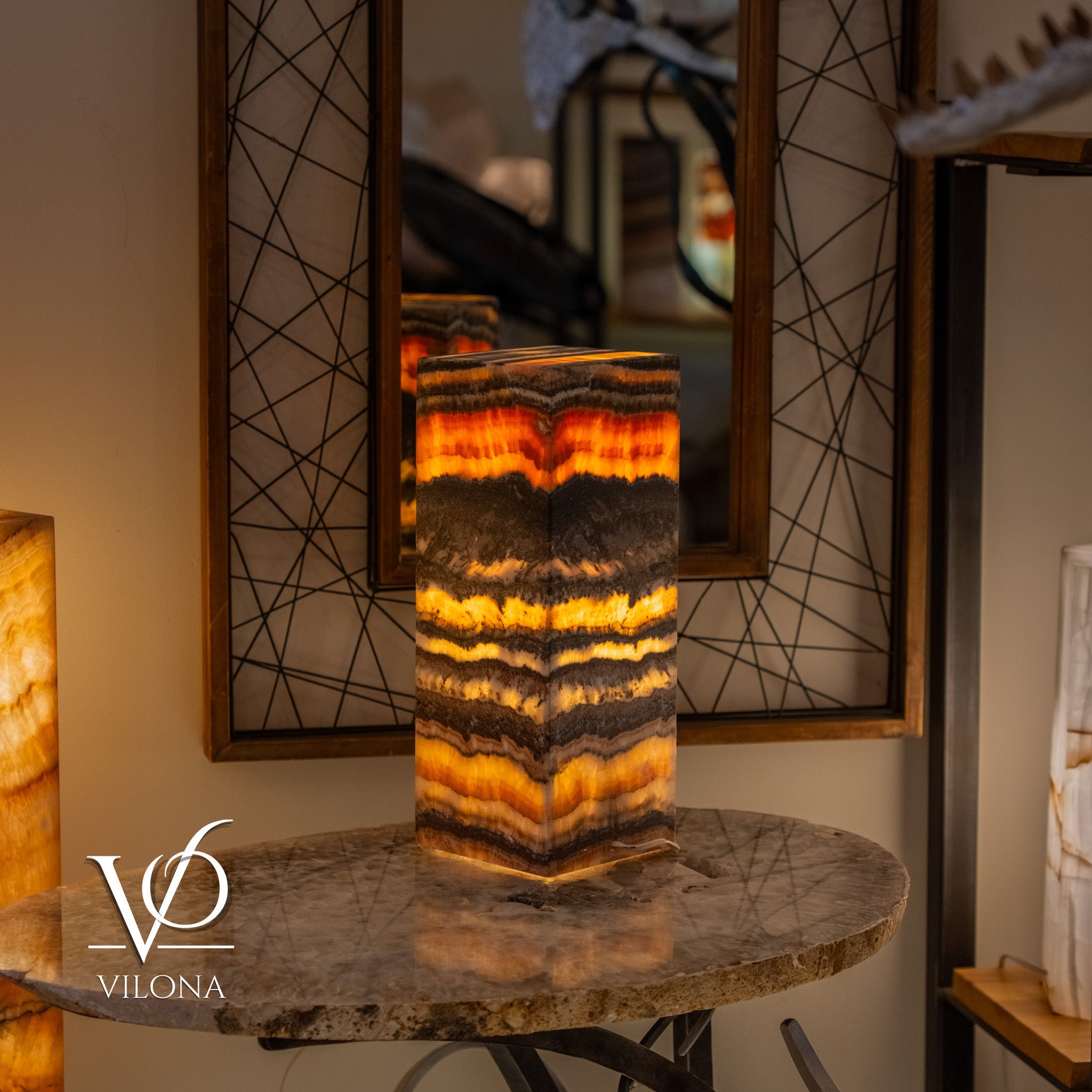 Tangerine Onyx Table Lamp with bright orange glowing band and layered natural stone pattern