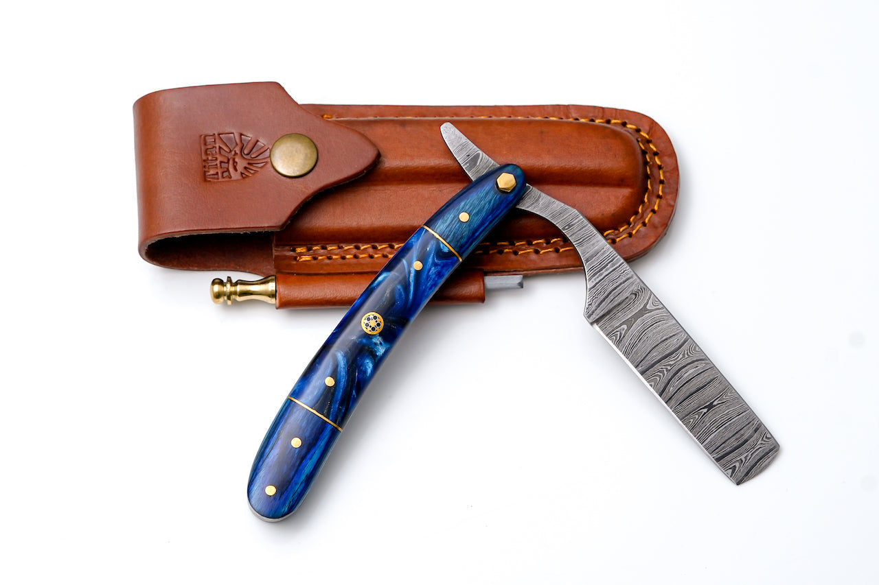 Damascus straight razor TK-439 resting on wooden surface