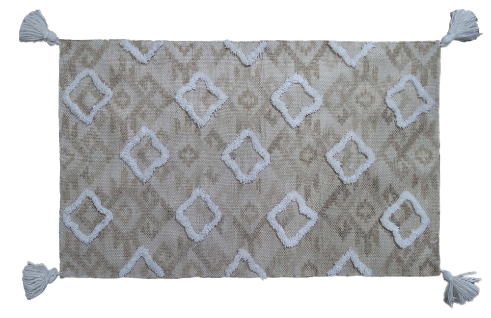 Tufted Shatter rug with diamond pattern and corner fringes laid on flooring