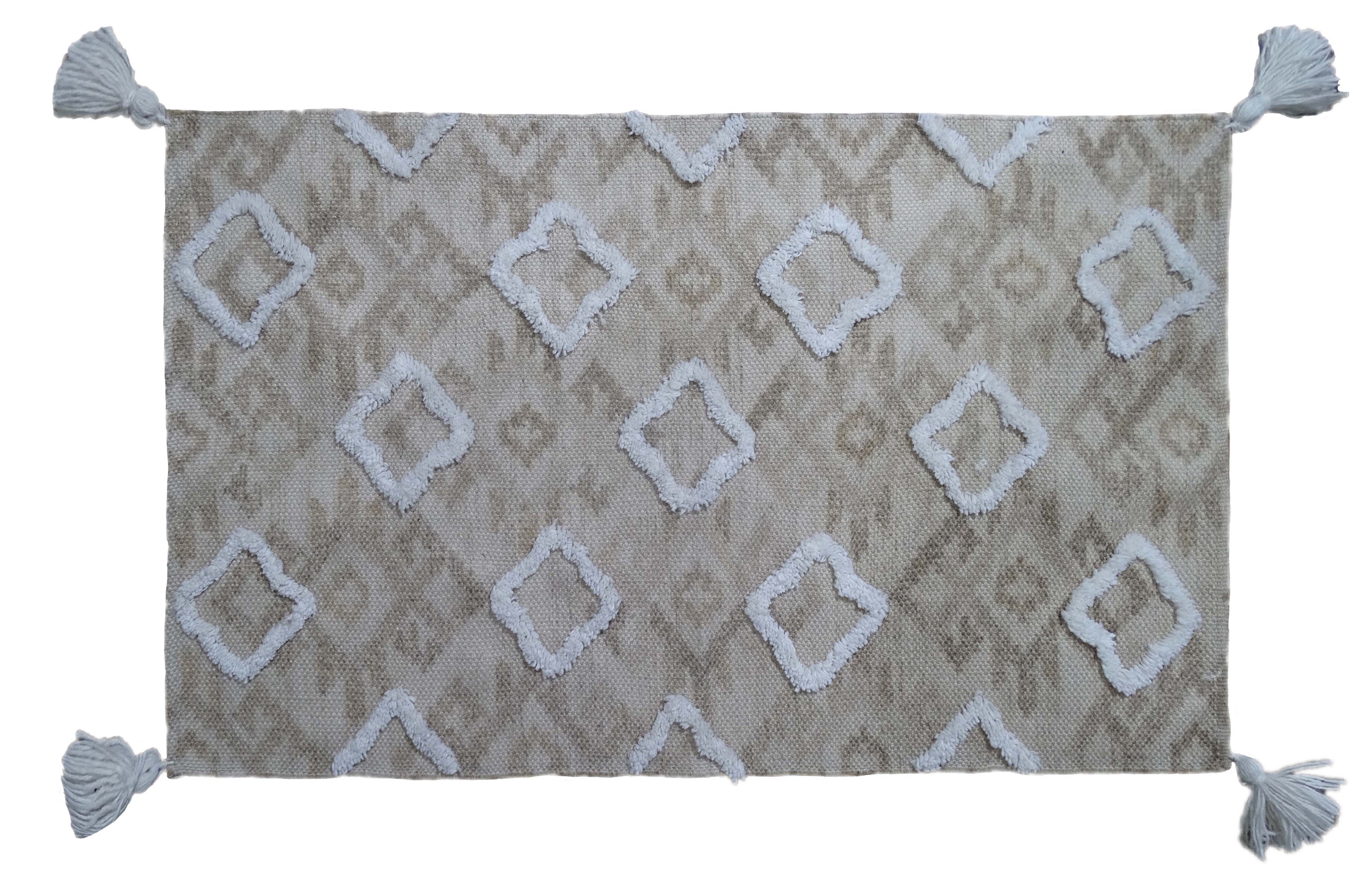 Tufted Shatter rug with diamond pattern and corner fringes laid on flooring