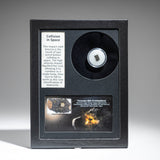 Genuine Tassédet 004 meteorite displayed in glass box with label and color image