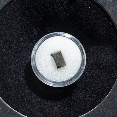 Genuine Tassédet 004 (Tchifaddine) Meteorite in Glass Display Box (Collision in Space)