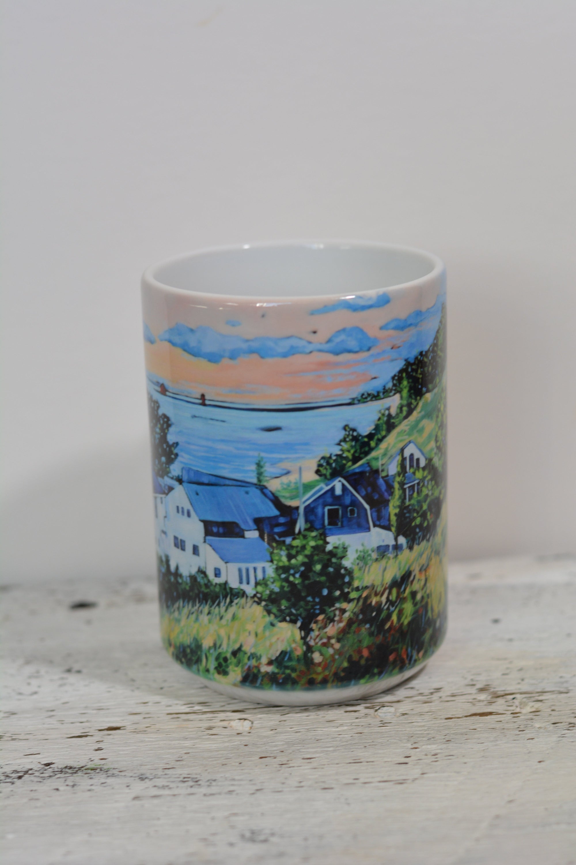 Drinkware collection including ceramic mugs and stainless steel tumbler with Views from Stickney Ridge artwork by Christi Dreese