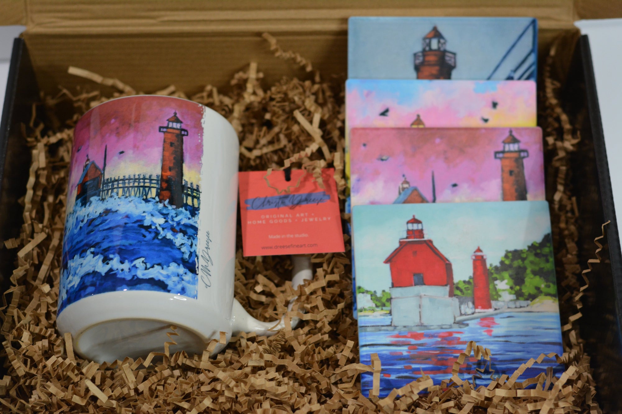 Grand Haven Lighthouse Gift Set showing mug and coasters with lighthouse imagery