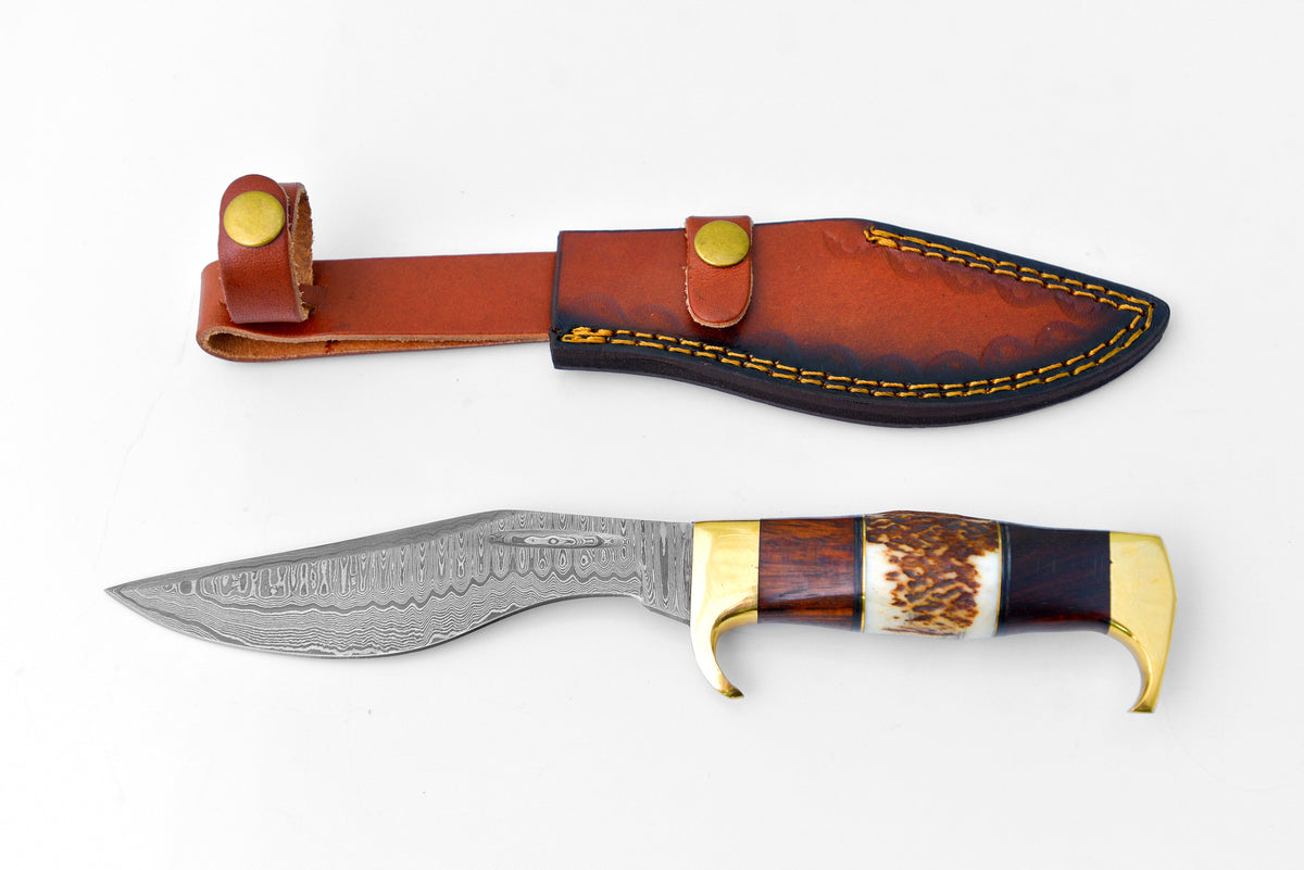 Damascus Steel Outdoor Chopping Tool with Stag Antler, Walnut Wood, and Brass Handle TK-127 on a dark surface