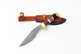 Damascus steel chopping knife with a curved blade, stag antler and walnut wood handle, alongside a brown leather sheath with brass button closures.