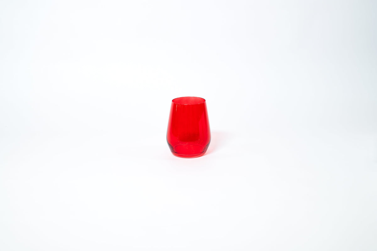 Cherry Red stemless colored wine glass showing rich red color on a clean white background