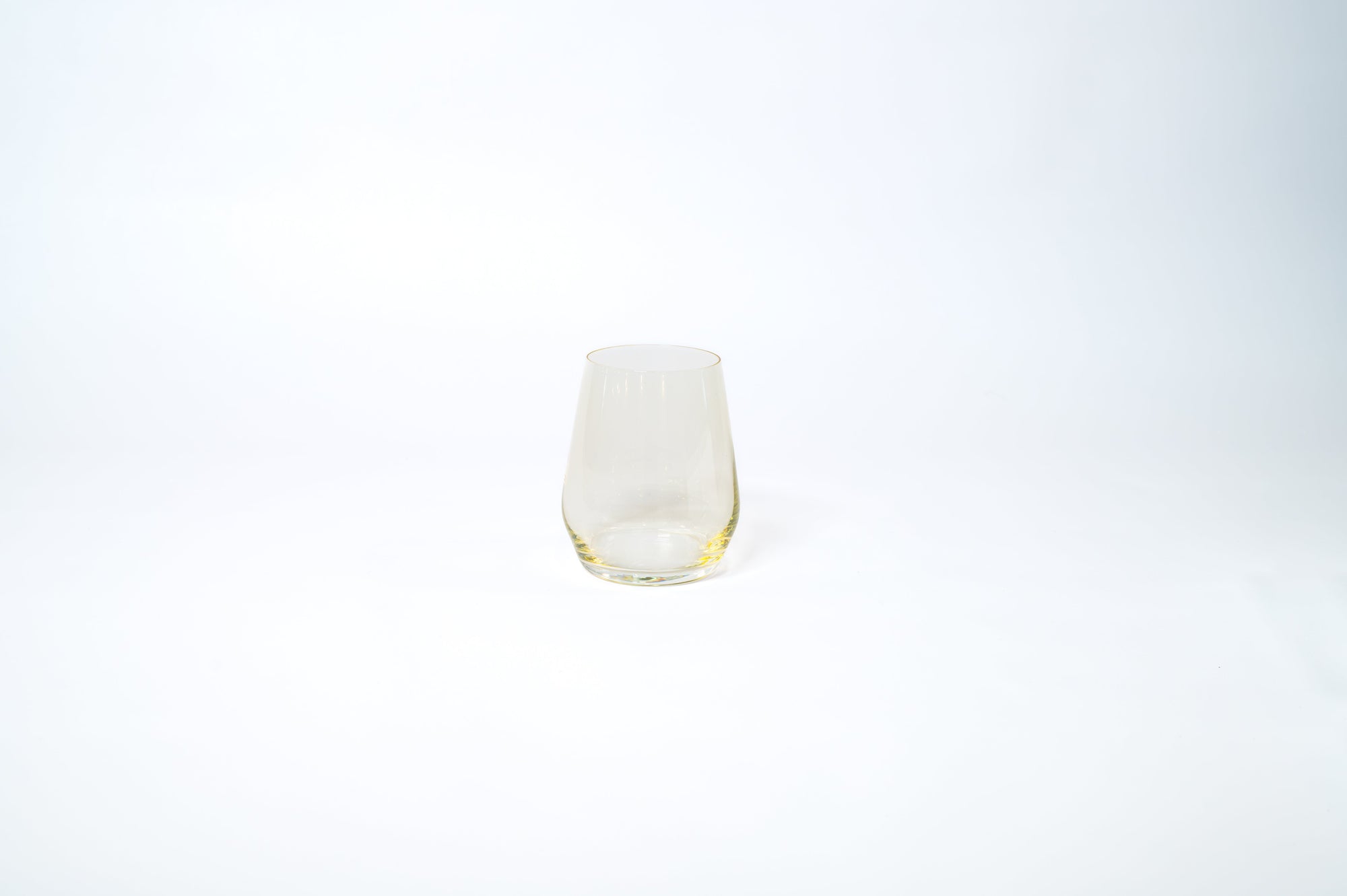 Yellow stemless wine glass from the Golden Hour Ombré Collection by glasshauseco