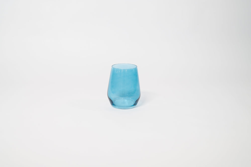 Blue Lagoon stemless colored wine glass showing soft blue tint with textured vertical ridges