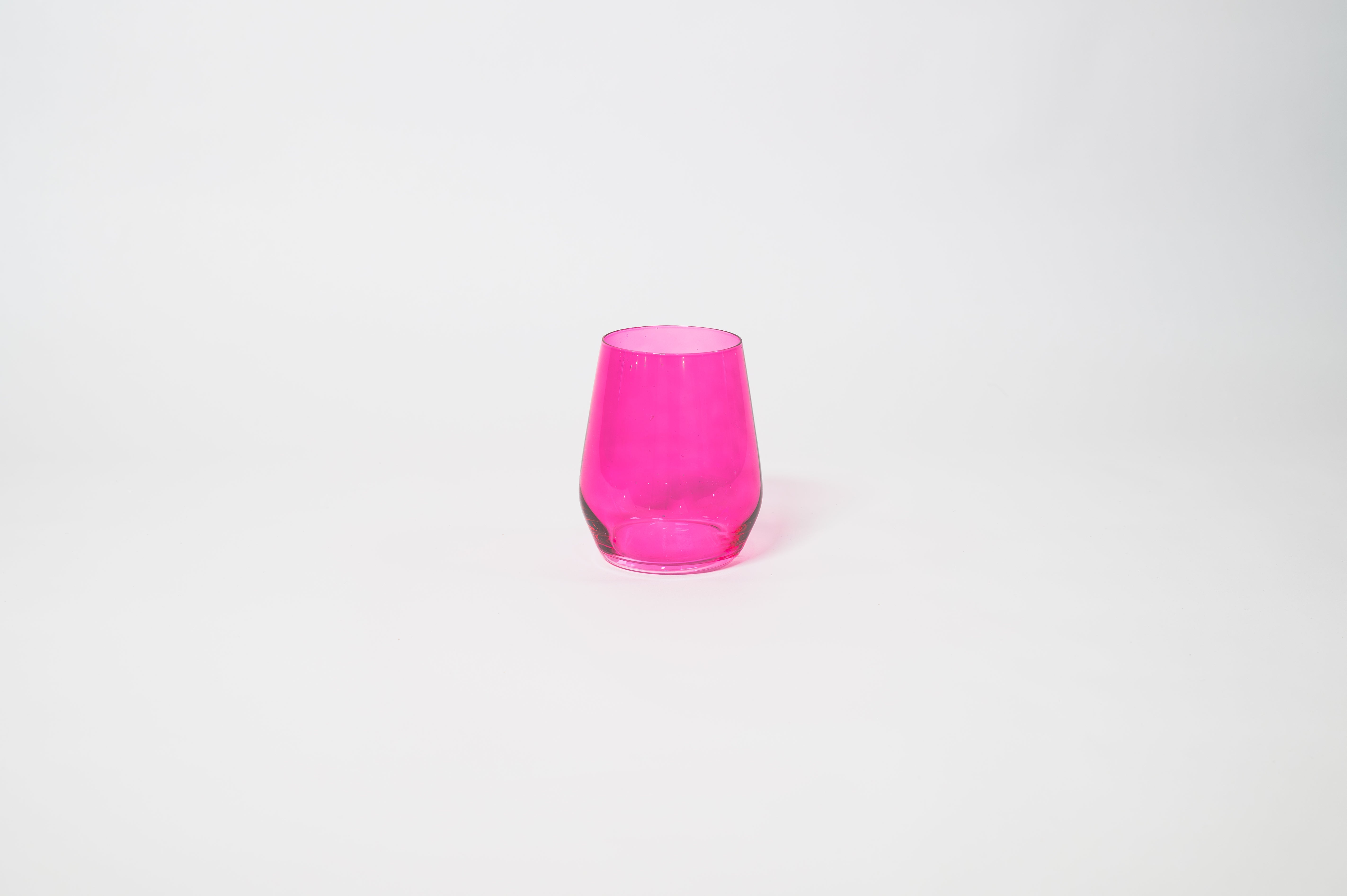 Hot Hot Pink stemless colored wine glass in a bright vibrant pink shade.
