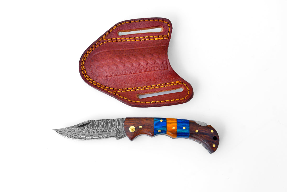 Damascus steel pocket knife Limited Run Black Diamond Wood TF-058 showing folded knife with hand-carved spine and leather sheath