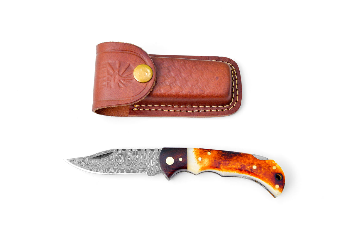 Damascus steel pocket knife Limited Run TF-070 showing hand-carved spine and wooden scales