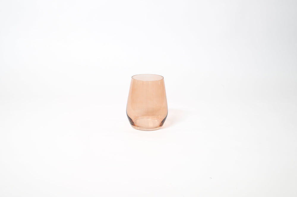 Brown Sugar Stemless Colored Wine Glass showing warm ombré hues on a wood table
