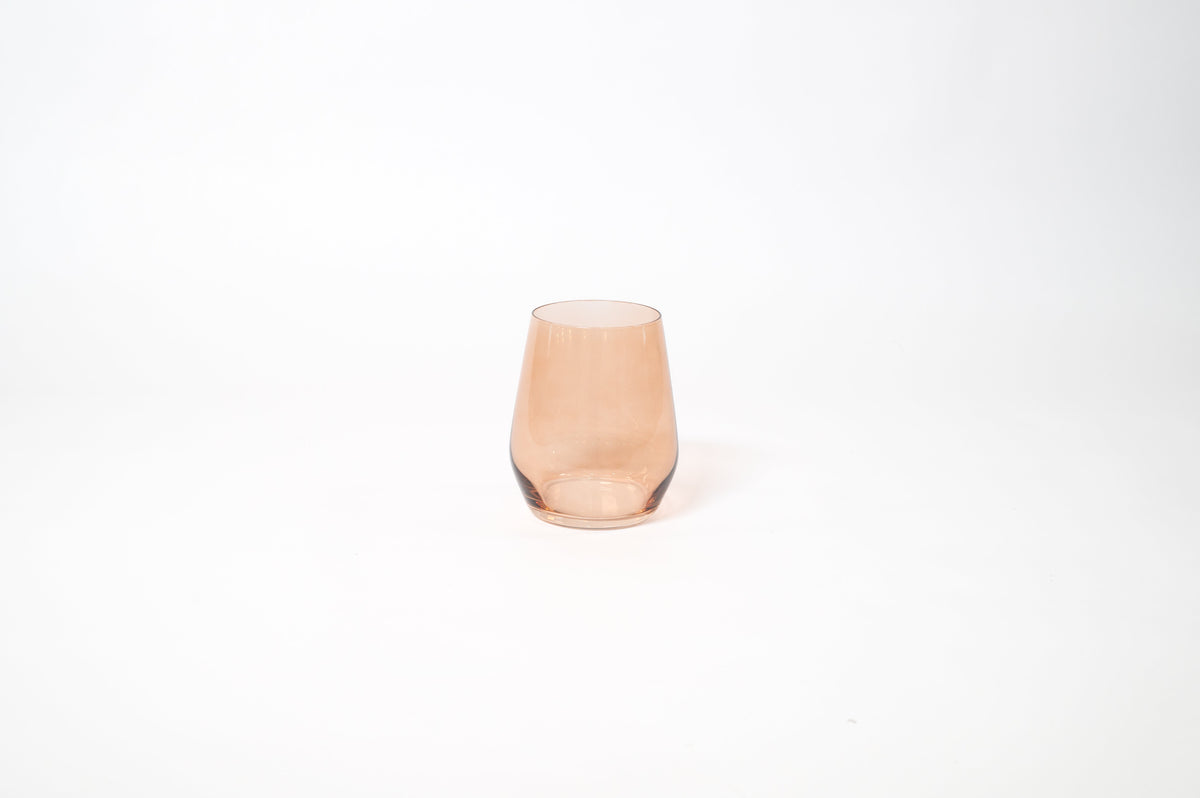 Brown Sugar Stemless Colored Wine Glass showing warm ombré hues on a wood table