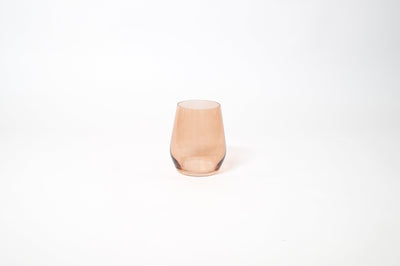 Brown Sugar Stemless Colored Wine Glass showing warm ombré hues on a wood table