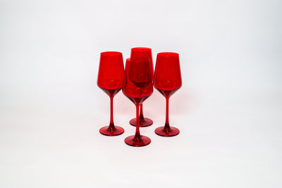 Cherry Red wine glass showcasing a rich cherry color with a clear stem, filled partially with red wine.