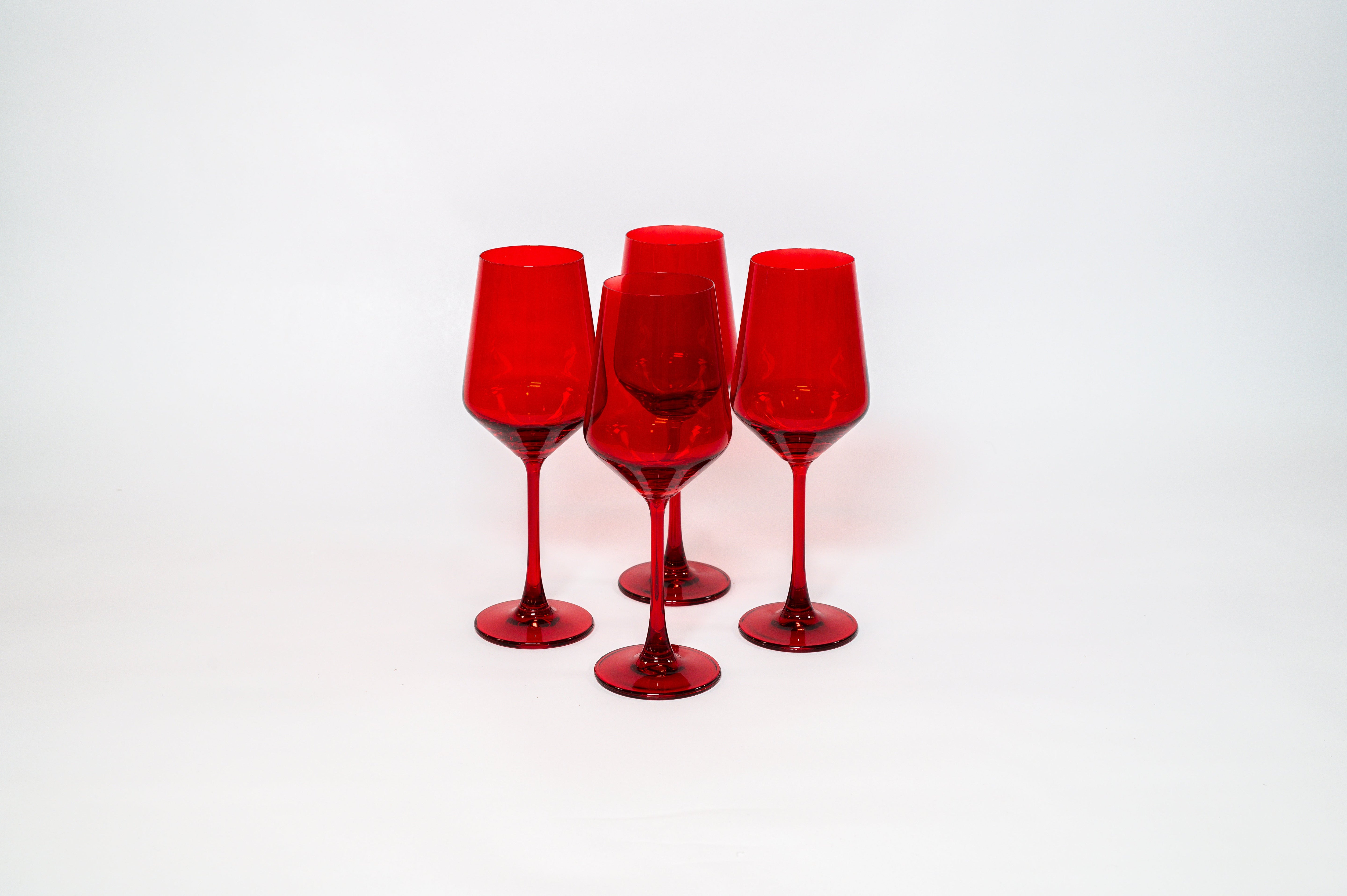 Cherry Red wine glass showcasing a rich cherry color with a clear stem, filled partially with red wine.