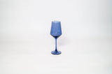 Tall blue-tinted wine glass with a slender stem and a slightly tapered bowl, set against a plain white background.