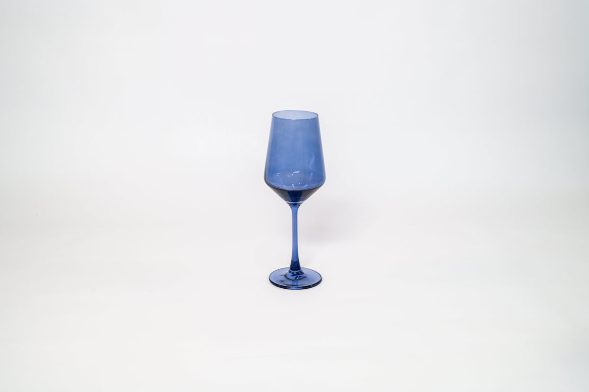 Tall blue-tinted wine glass with a slender stem and a slightly tapered bowl, set against a plain white background.