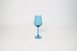 Transparent blue wine glass with a long stem and a conical bowl, centered on a plain white background.