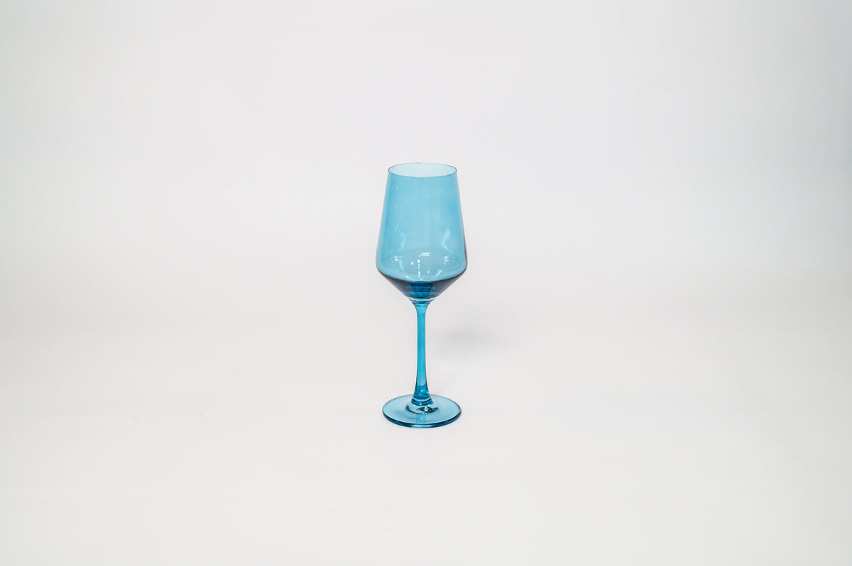 Transparent blue wine glass with a long stem and a conical bowl, centered on a plain white background.