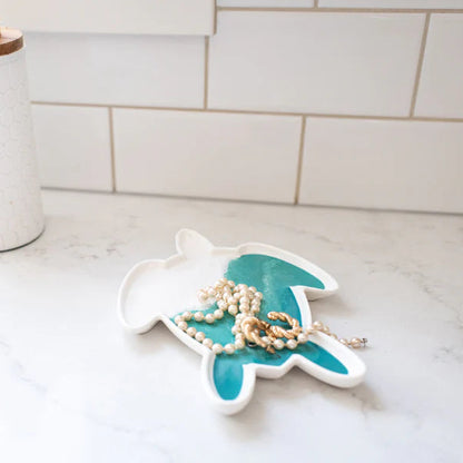 resin turtle-shaped trinket dish with pearls on a kitchen counter
