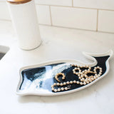 Ceramic whale-shaped tray with hand-poured resin swirls in coastal colors