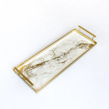 Rectangular gold resin serving tray with built-in handles and rubber feet on a white background