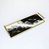 Rectangular gold resin serving tray with built-in handles and rubber feet on a white background