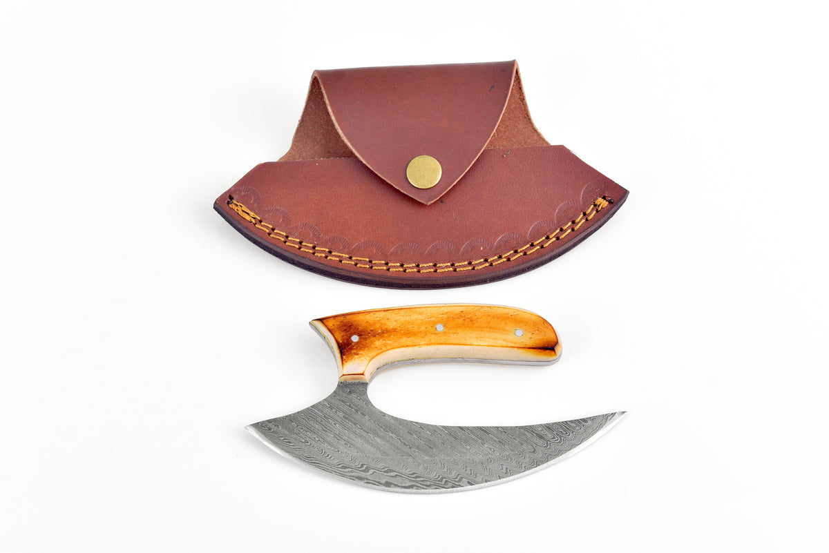 Damascus Steel Burnt Bone TK-103 fixed blade knife with burnt bone handle on a dark surface